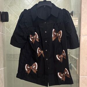 Black Short Sleeve woman’s Shirt with puff sleeves and Bow Accents- new!!!